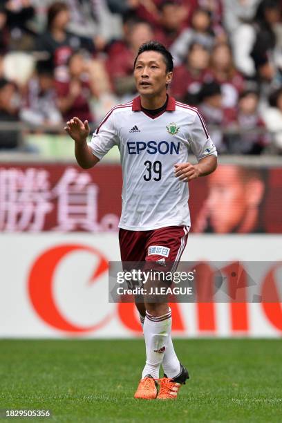 Yoshiro Abe of Matsumoto Yamaga celebrates after scoring the team's first goal during the J.League J1 second stage match between Vissel Kobe and...