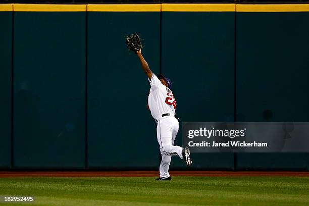 Michael Bourn of the Cleveland Indians catches a fly ball to center field by David DeJesus of the Tampa Bay Rays in the first inning during the...