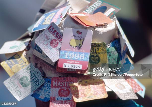 Hat decorated with past Masters entry tickets worn by a spectator during the US Masters Golf Tournament held at the Augusta National Golf Club circa...