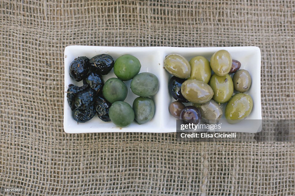 Mixed olives on a white plate