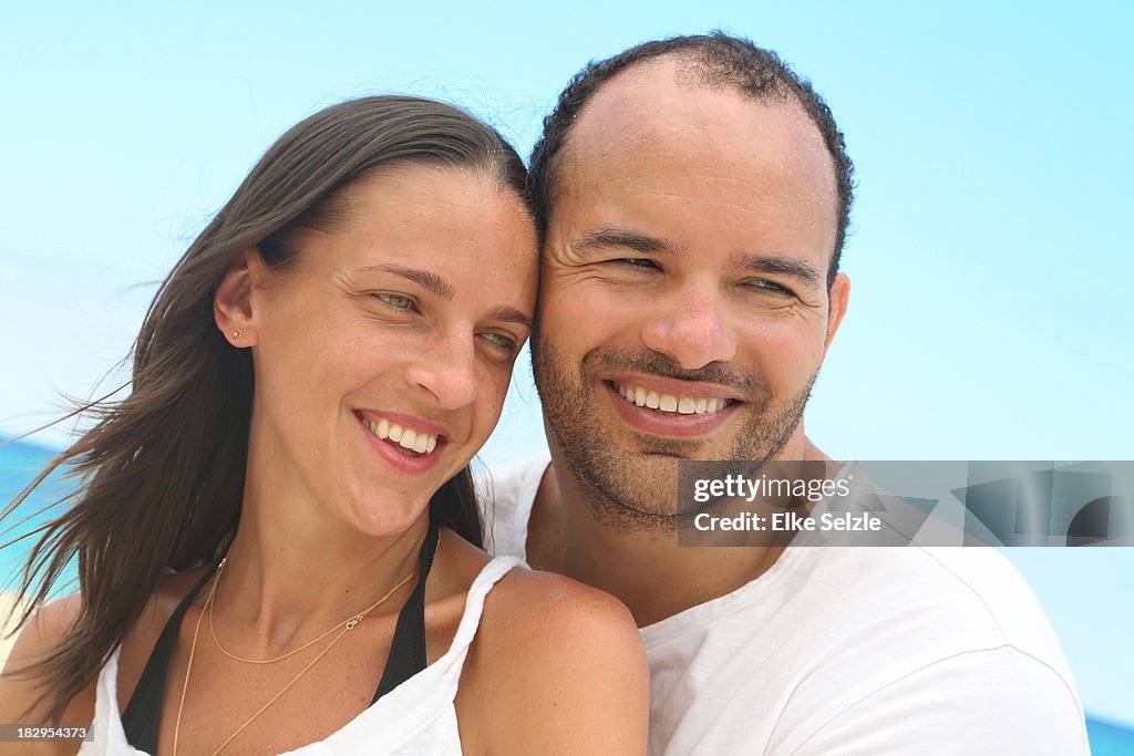 Close-up of romantic couple on beach