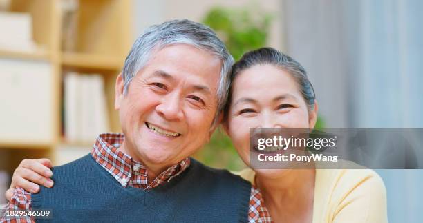 old couple embracing - korean people stock pictures, royalty-free photos & images