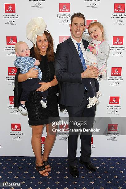 Collingwood Magpies Captain Nick Maxwell poses with his wife Erin Maxwell and their two children at the Emirates Stakes Day Fashion on the Field...