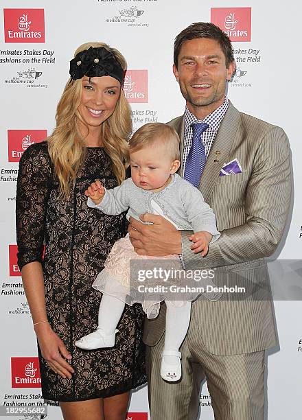 Television presenter Brodie Harper and her husband Heath Meldrum pose with their daughter Jessica at the Emirates Stakes Day Fashion on the Field...