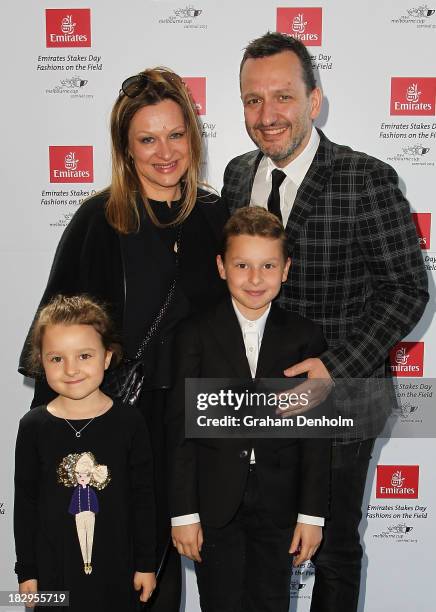 Designer Arthur Galan and his wife Mimi Galan pose with their children at the Emirates Stakes Day Fashion on the Field Launch at Flemington...