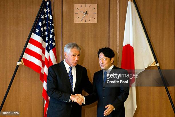 Secretary of Defense Chuck Hagel shakes hands with Japanese Defense Minister Itsunori Onodera, before their meeting at Defense Ministry on October 3,...