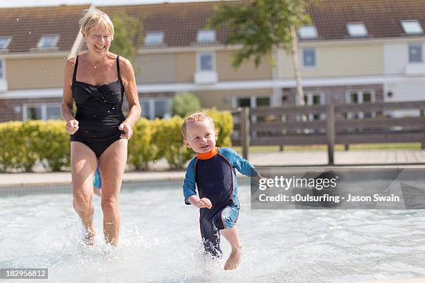 family fun by the pool - nanny stock pictures, royalty-free photos & images