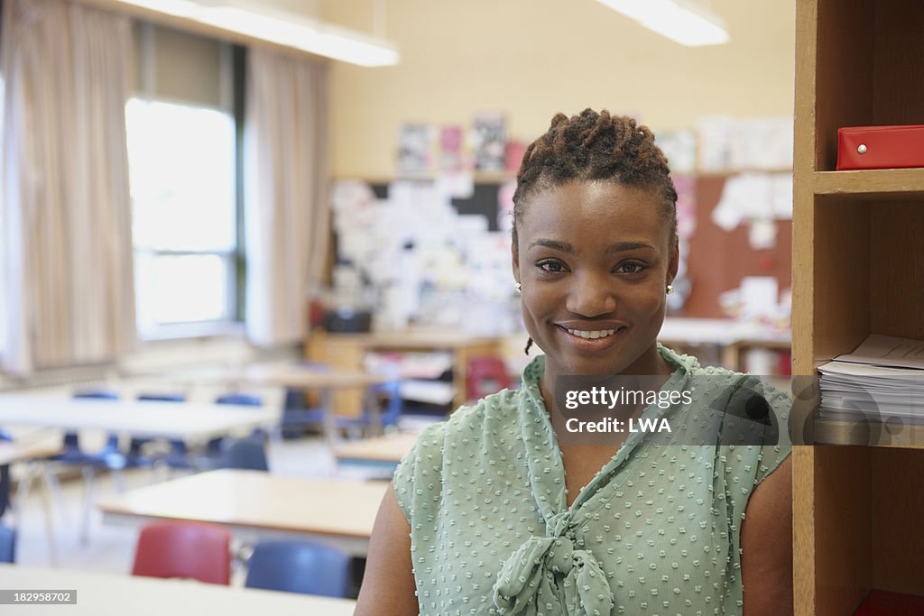 Smiling teacher in classroom