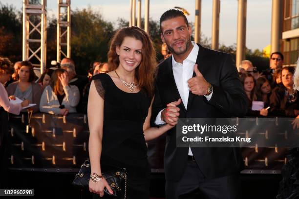 Manuel Charr and friend Amira attend the Deutscher Fernsehpreis 2013 - Red Carpet Arrivals at Coloneum on October 02, 2013 in Cologne, Germany.