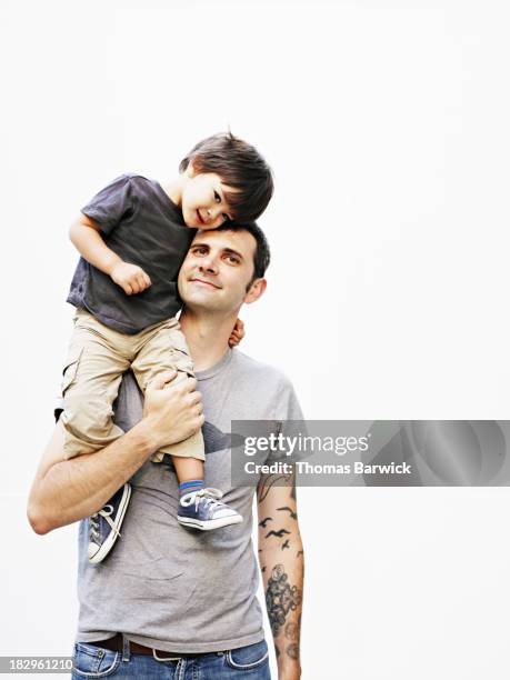 father holding son on shoulder - family white background stock pictures, royalty-free photos & images