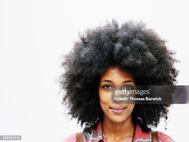 smiling woman with afro hairstyle - afro frisur stock-fotos und bilder