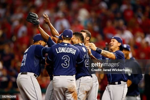 The Tampa Bay Rays celebrate defeating the Cleveland Indians in the American League Wild Card game at Progressive Field on October 2, 2013 in...