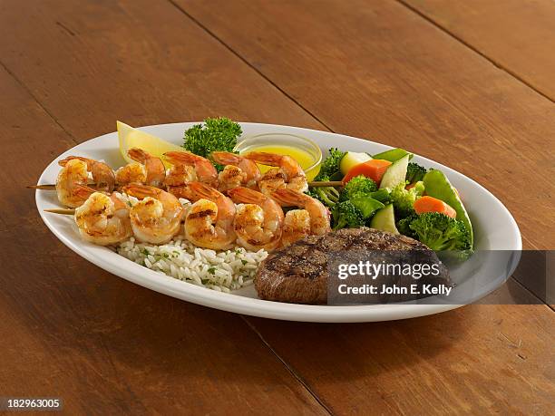 grilled steak and skewered shrimp dinner - beefsteak 2013 stock pictures, royalty-free photos & images