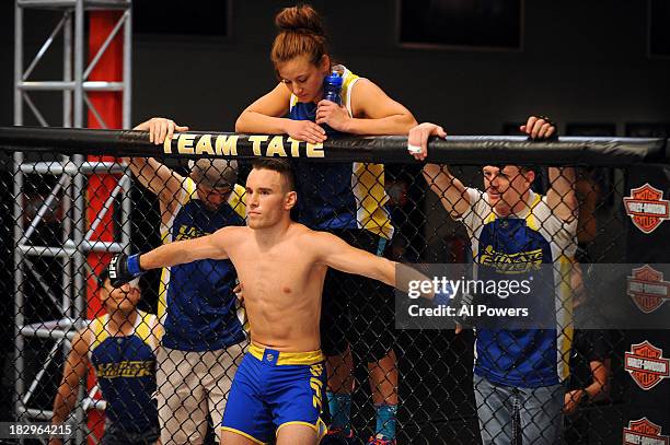 Louis Fisette stands in his corner with Coach Miesha Tate prior to facing David Grant in their preliminary fight during filming of season eighteen of...