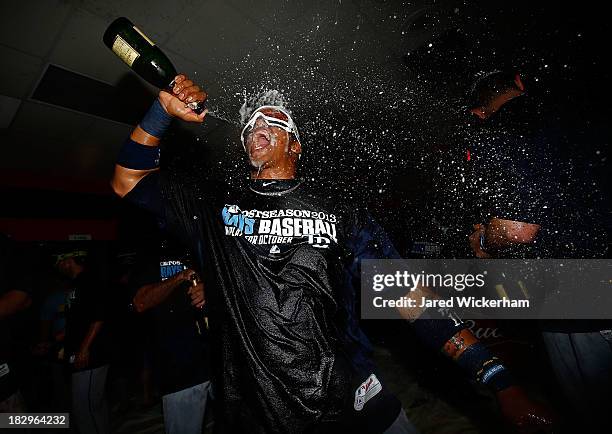 Yunel Escobar of the Tampa Bay Rays celebrates in the clubhouse following their 4-0 win against the Cleveland Indians during the American League Wild...