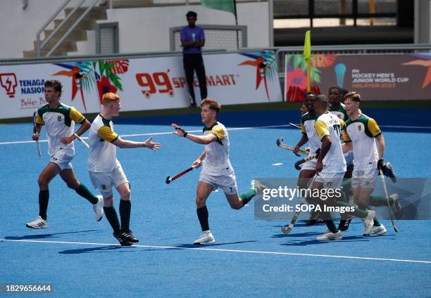 Team players of South Africa celebrate after scoring a goal during the FIH Hockey Men's Junior World Cup Malaysia 2023 match between Germany and...