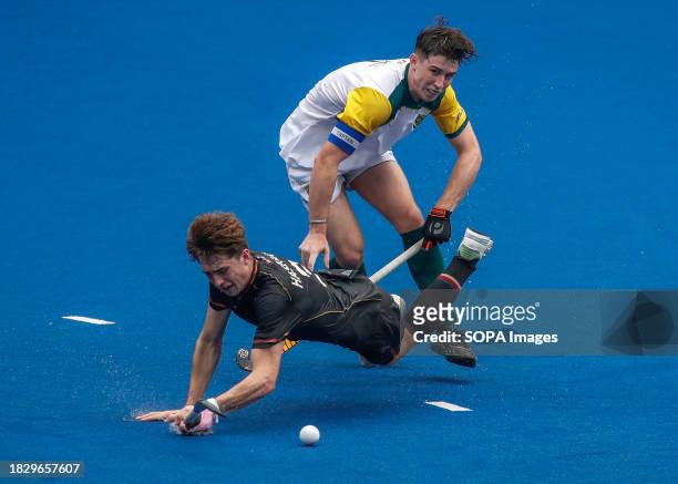 Ben Hasbach of Germany and Nathan Ansell of South Africa in action during the FIH Hockey Men's Junior World Cup Malaysia 2023 match between Germany...