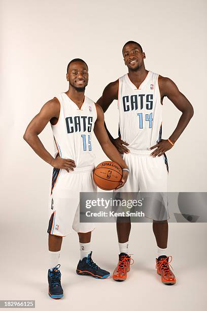 Kemba Walker and Michael Kidd-Gilchrist of the Charlotte Bobcats pose for a portrait on media day at the Time Warner Cable Arena on September 30,...