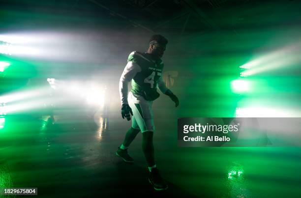 Bryce Huff of the New York Jets walks out of the tunnel before the game against the Atlanta Falcons at MetLife Stadium on December 03, 2023 in East...