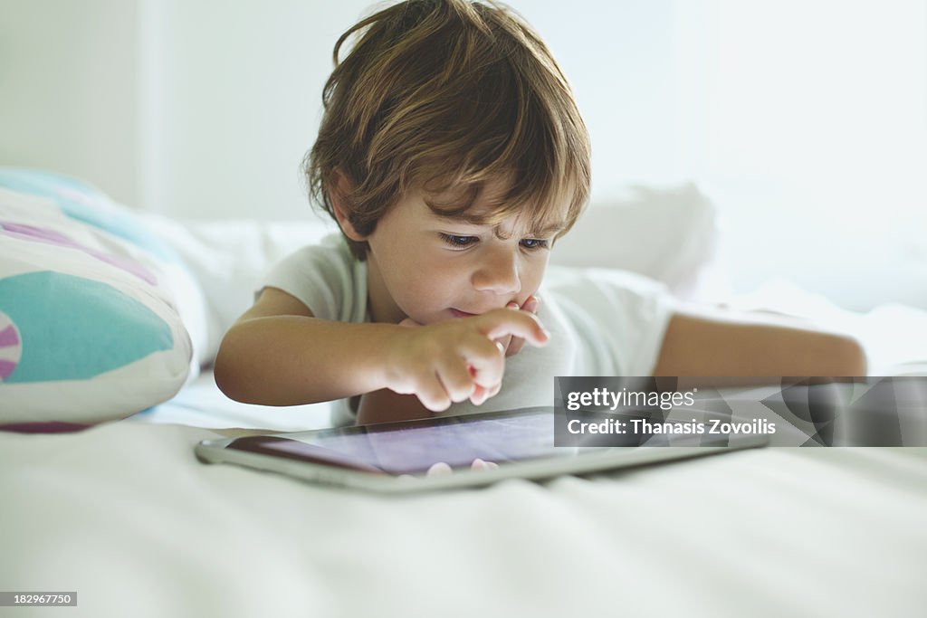 Portrait of a small boy using a tablet