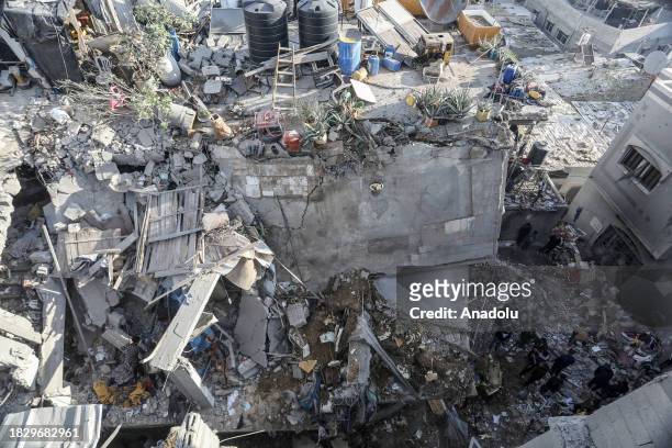 Palestinians and civil defense teams carry out search and rescue operations after Israeli army carried out attacks on al-Shabura refugee camp during...