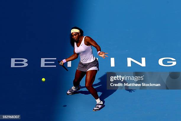 Serena Williams of the United States returns a shot to Maria Kirilenko of Russia during day six of the 2013 China Open at the National Tennis Center...