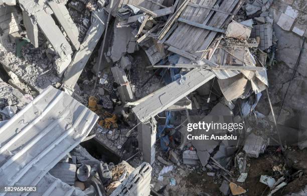 Palestinians and civil defense teams carry out search and rescue operations after Israeli army carried out attacks on al-Shabura refugee camp during...