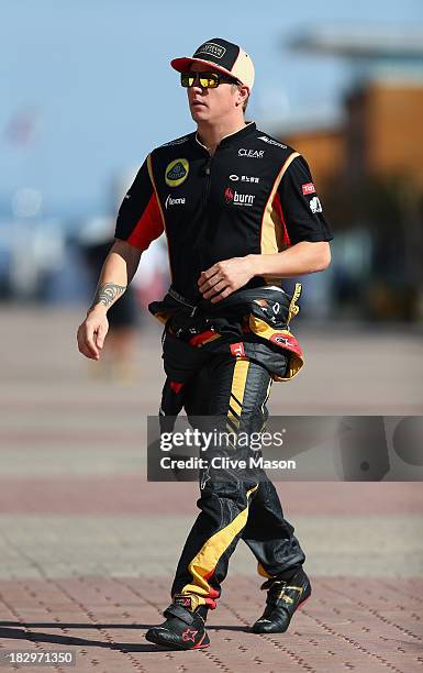 Kimi Raikkonen of Finland and Lotus walks in the paddock during previews for the Korean Formula One Grand Prix at Korea International Circuit on...