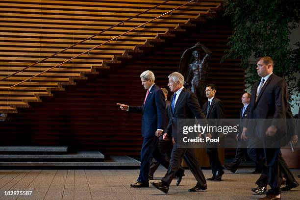 Secretary of State John Kerry, and U.S. Secretary of Defense Chuck Hagel leave Kantei, the Prime Minister's Official Residence, after meeting with...