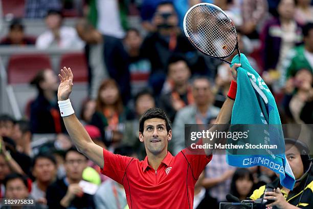 Novak Djokovic of Serbia acknowledges the crowd after his win over Fernando Verdasco of Spain during day six of the 2013 China Open at the National...