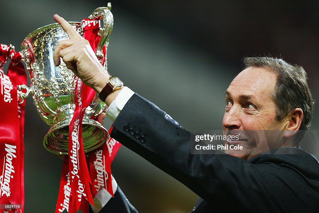 Liverpool manager Gerard Houllier celebrates winning the Worthington Cup