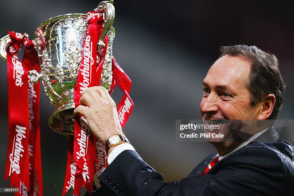 Liverpool manager Gerard Houllier celebrates winning the Worthington Cup