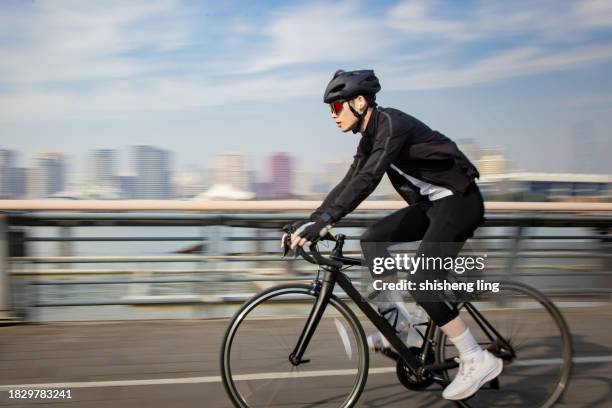 cyclists in the city - superslowmotion stockfoto's en -beelden