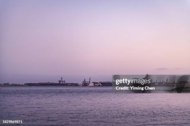 uss carl vinson (cvn-70) and uss theodore roosevelt (cvn-71)  aircraft carriers pierside at naval air station north island - san diego bay stock pictures, royalty-free photos & images