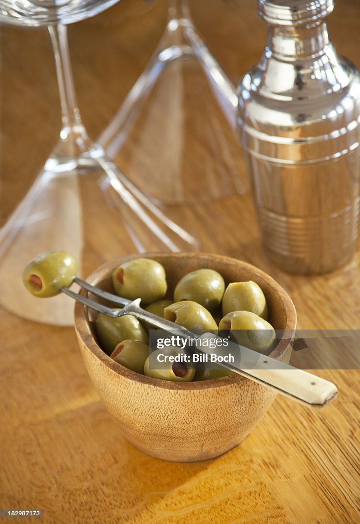 Bowl of cocktail olives with old fork