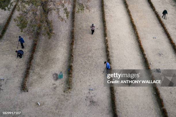 People play gateball near the Han River in Seoul on December 7, 2023.