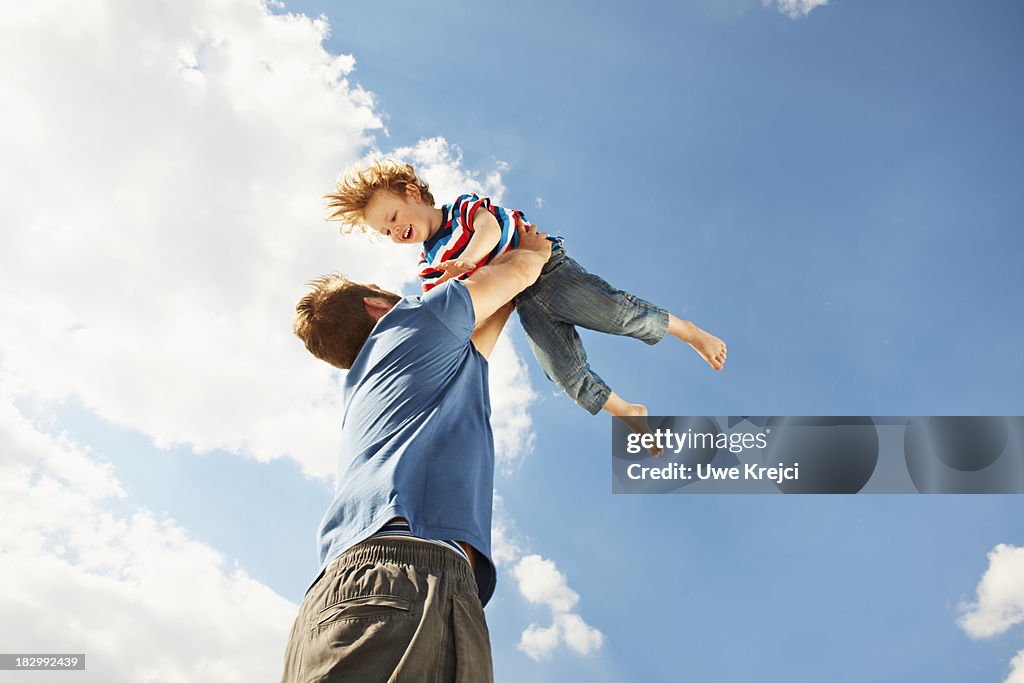 Father and son playing