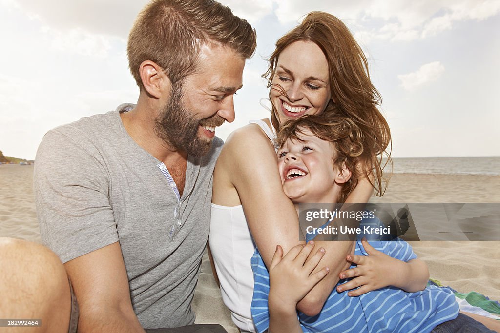 Happy family on the beach, portrait