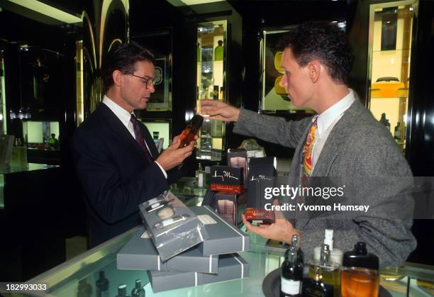 Man is photographed September 15, 1991 at Bloomingdale's in New York City buying a fragrance. Bloomingdale's, an upscale department store, is known...