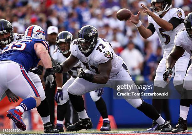 Kelechi Osemele of the Baltimore Ravens blocks on the offensive line as Joe Flacco receives the snap during NFL game action against the Buffalo Bills...