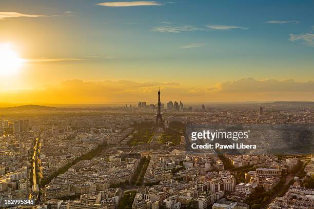 eiffel tower in paris at sunset - paris aerial stock pictures, royalty-free photos & images