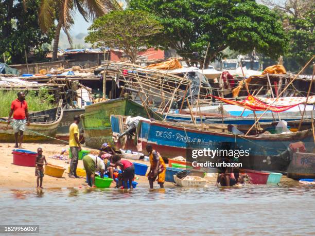 old ships on the riverbank in barra do dande in angola - angola infrastructure stock pictures, royalty-free photos & images