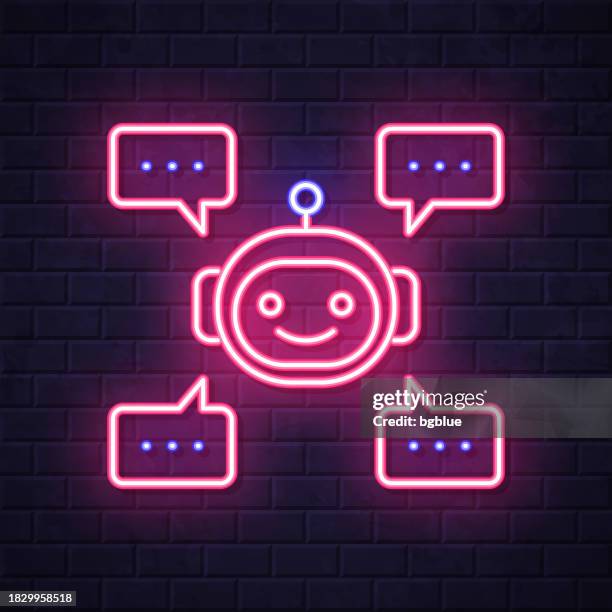 chatbot with speech bubbles. glowing neon icon on brick wall background - computer glow on face stock illustrations