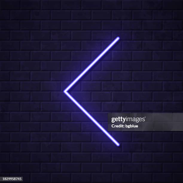 chevron left. glowing neon icon on brick wall background - chevron icon stock illustrations