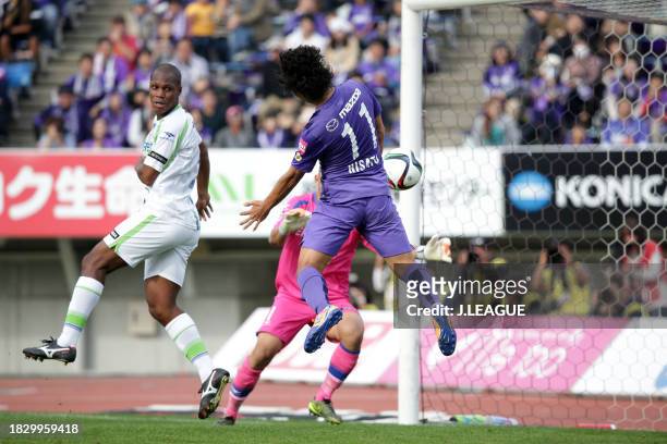 Hisato Sato of Sanfrecce Hiroshima heads to score the team's third goal during the J.League J1 second stage match between Sanfrecce Hiroshima and...