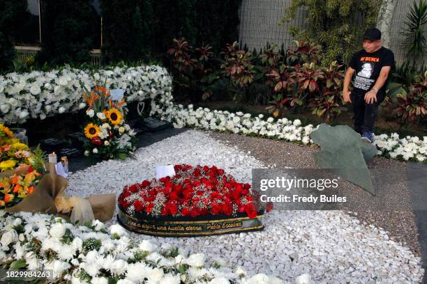 Faithful devotee of Pablo Escobar, Miguel Ángel Cardona attends Pablo Escobar's grave at Jardines Montesacro cementery during 30th anniversary of the...