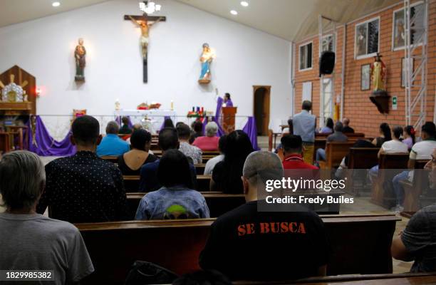 Man whit a t-shirt that says "Wanted" attends the 30th anniversary mass of the late Colombian drug trafficker Pablo Escobar on December 02, 2023 in...