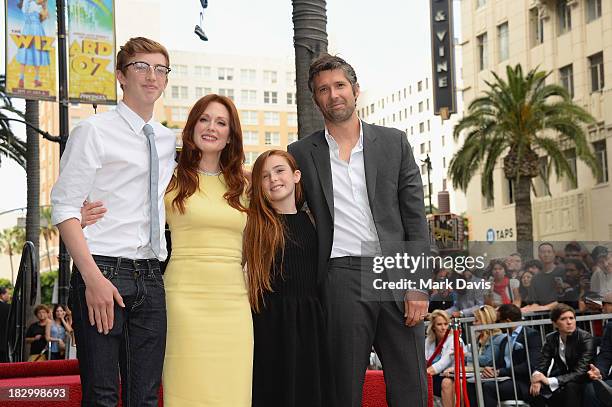 Actress Julianne Moore is joined by her family, son Cal Freundlich, daughter Liv Freundlich and husband Bart Freundlich as she is honored with a star...