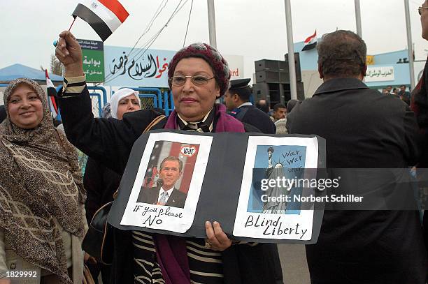 Woman joins in with thousands of demonstrators as they protest a possible U.S. War against Iraq March 5, 2003 in a huge rally near the stadium in...