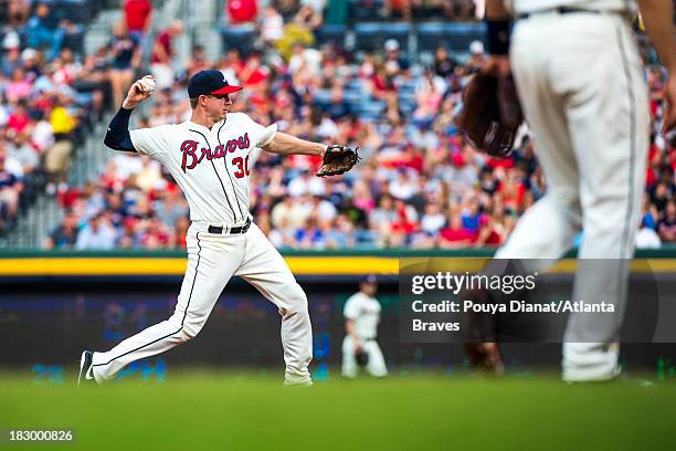 Elliot Johnson of the Atlanta Braves pitches against the Miami Marlins at Turner Field on September 1, 2013. The Marlins won 7-0.